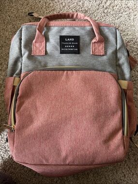 LAND backpack with fold out changing pad.  Two-Tone Grey and Pink Backpack